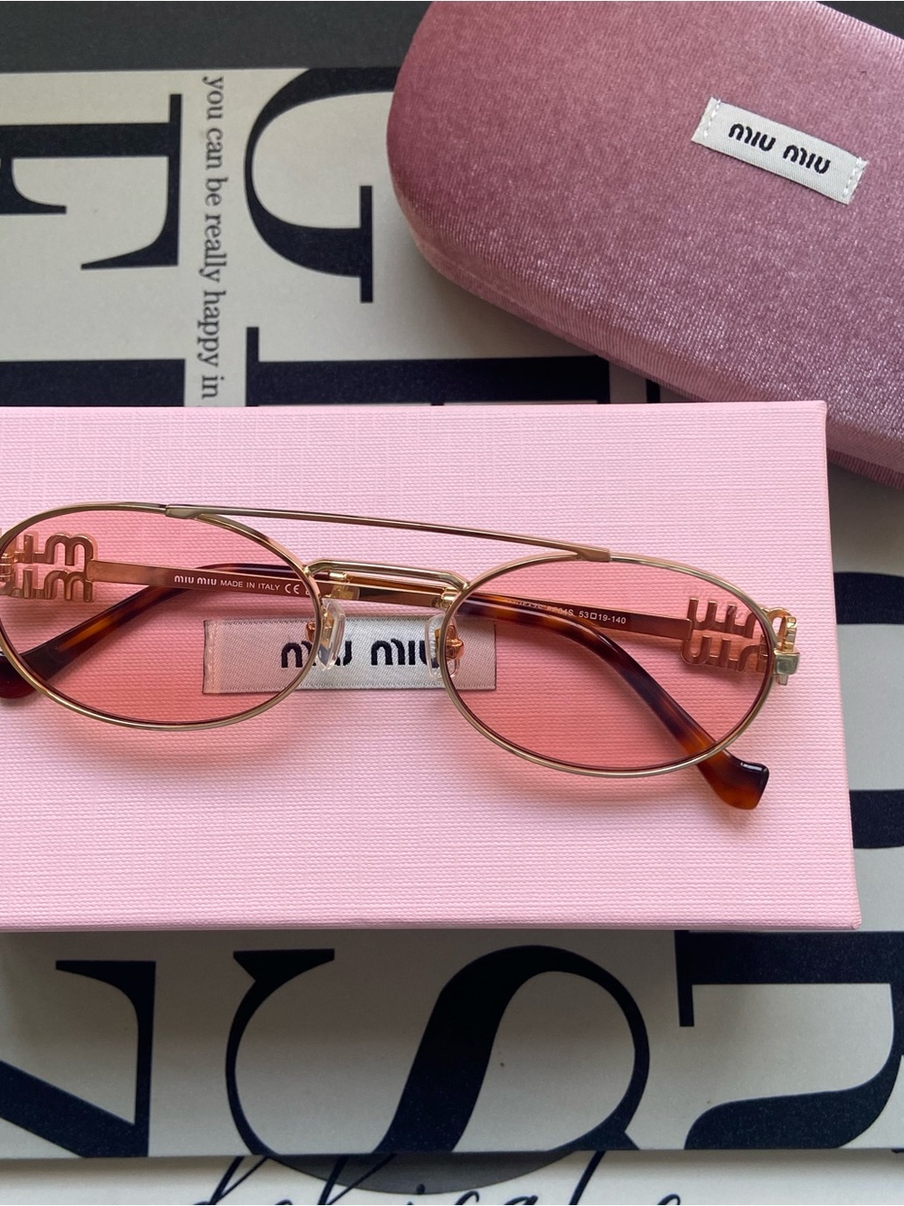Miu Miu Gold Frame Sunglasses with Pink Lenses